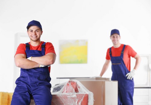 Removal Van Barnes team handling furniture safely during a move