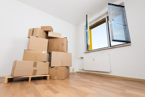 Office furniture and boxes prepared for a business move in Barnes