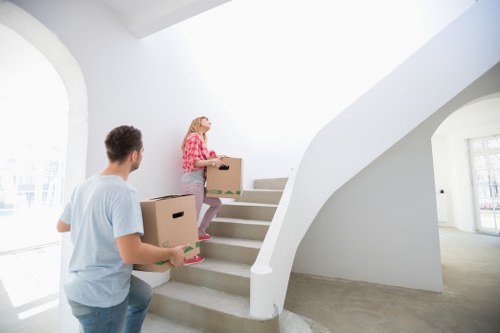 Professional moving van service handling boxes and furniture