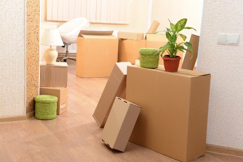 Mover handling boxes during a removal van job