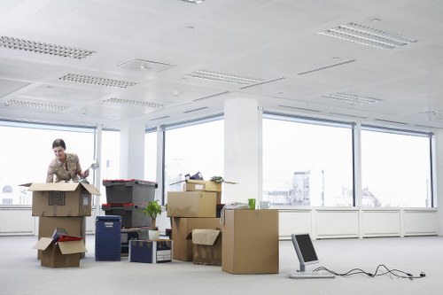 Packed office equipment ready for relocation in Barnes