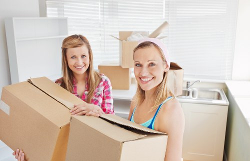 Boxes and office furniture organised for a business move in Barnes