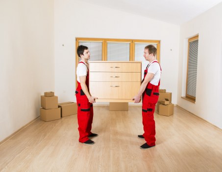 Packed boxes and furniture ready for a home removal in Barnes